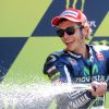 Second placed Italian rider Valentino Rossi sprays champagne on the podium of the French motorcycling Grand Prix, on May 18, 2014 at the Le Mans' circuit, western France. AFP PHOTO / JEAN FRANCOIS MONIER        (Photo credit should read JEAN-FRANCOIS MONIER/AFP/Getty Images)